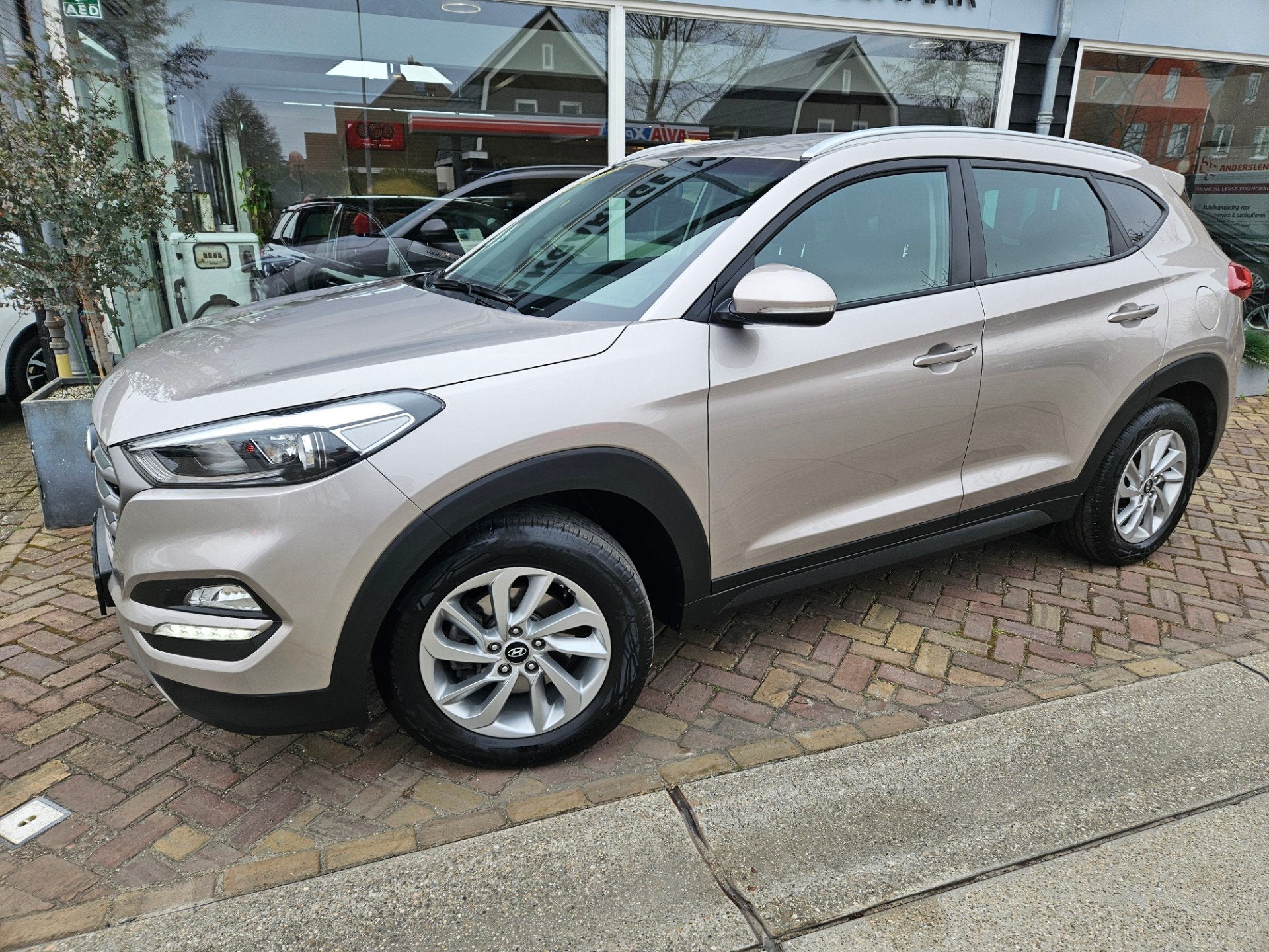Hyundai TUCSON 1.6 T-GDi i-Motion 4WD,full optionsautomaat, Auto's, Gebruikt, 4 cilinders, Bruin, Bedrijf