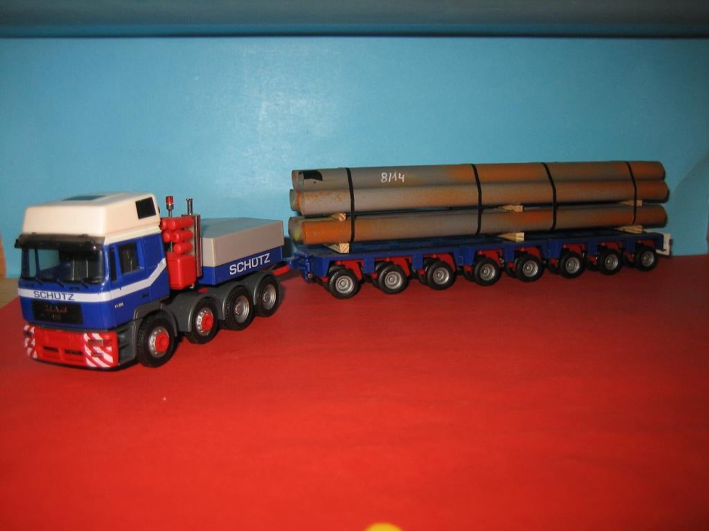 Schutz  Zwaar-transport  MAN met dieplader en lading Herpa, Hobby en Vrije tijd, Modelauto's | 1:87, Ophalen of Verzenden, Zo goed als nieuw