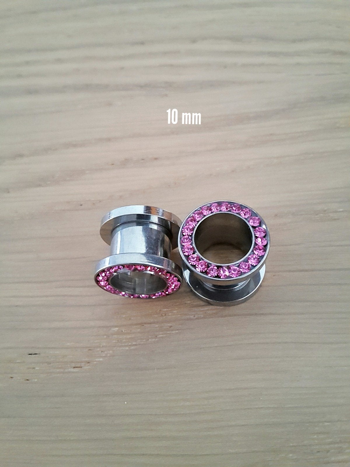 Nieuwe tunnels, pluggen. Staal. Roze steentjes., Sieraden, Tassen en Uiterlijk, Piercings, Ophalen of Verzenden, Zo goed als nieuw