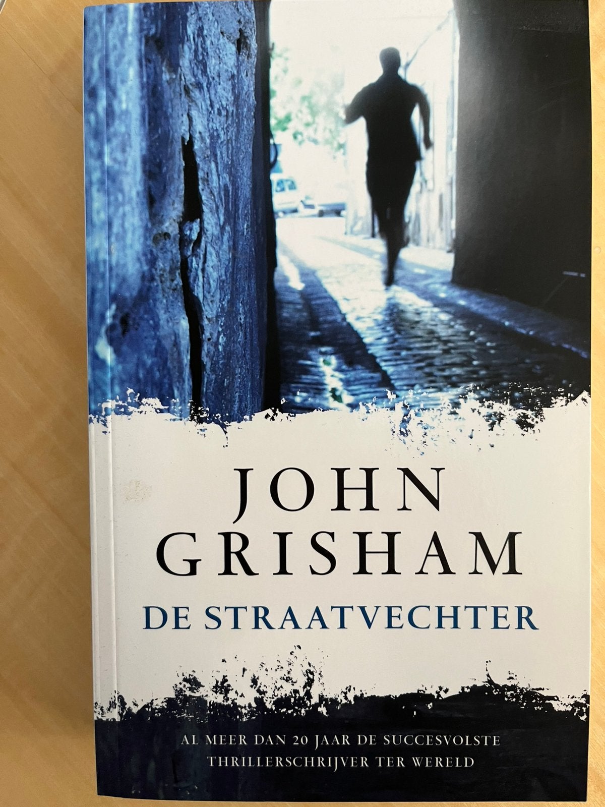 John Grisham - De Straatvechter, Ophalen of Verzenden, Zo goed als nieuw, John Grisham, Amerika