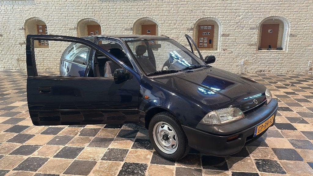 Suzuki Swift 1.3 GL AUT U9 1993 Blauw, Auto's, Suzuki, Voorwielaandrijving, Stof, Blauw, Origineel Nederlands