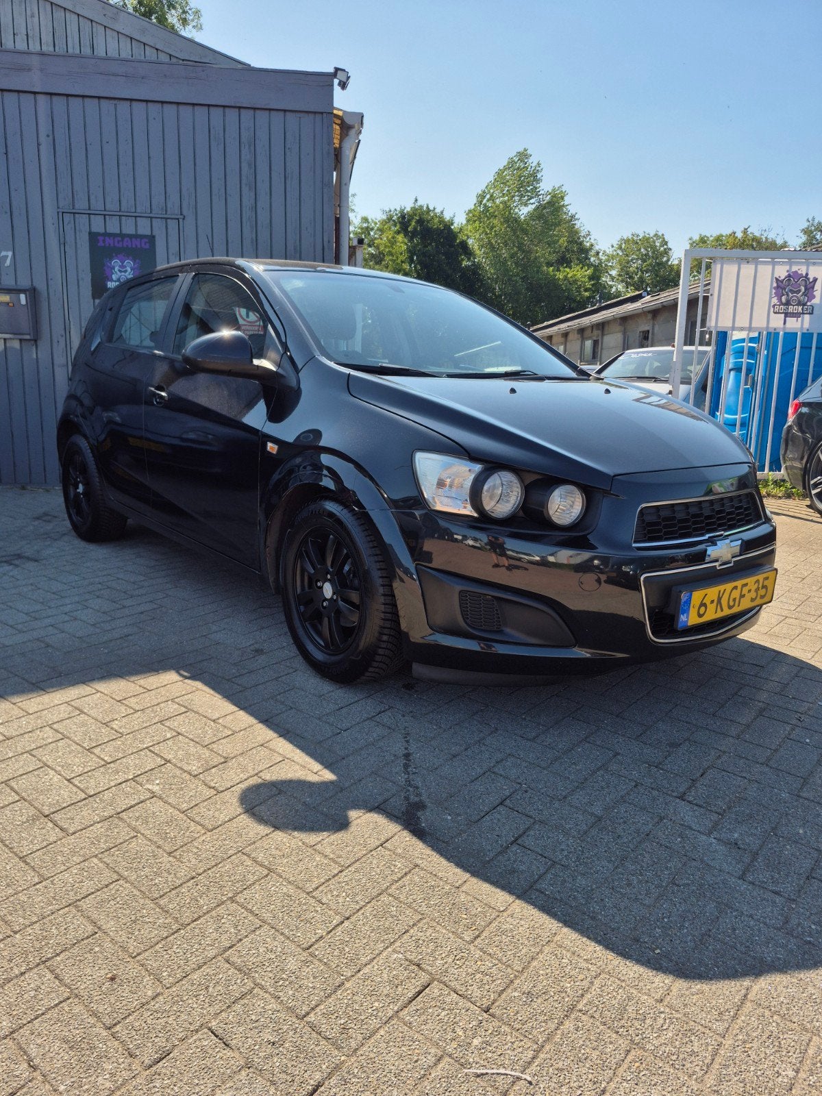 Chevrolet Aveo 1.4 5D 2012 Zwart NIEUWE APK, Voorwielaandrijving, 4 cilinders, 100 pk, Particulier