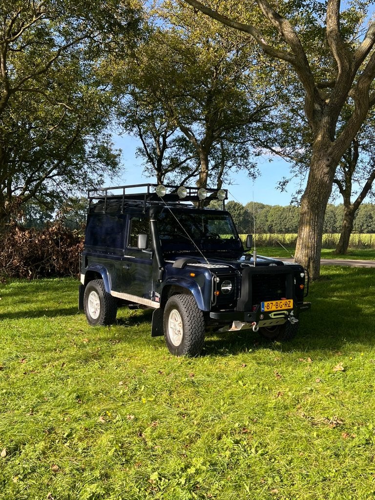 Land Rover Defender 90 TD5 Hard Top 2003, Auto's, Stof, 2495 cc, Blauw, Origineel Nederlands
