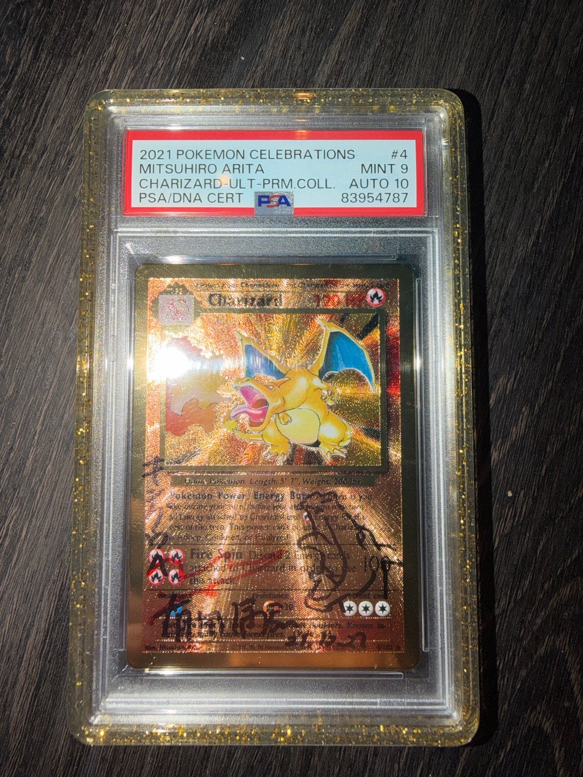 Charizard Celebrations #4 PSA 9 AUTO 10 Mitsuhiro Arita Sign, Ophalen of Verzenden, Zo goed als nieuw, Losse kaart, Foil