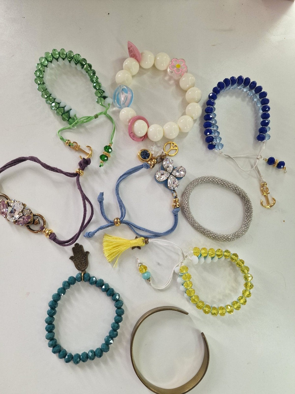 Vrolijke set van 9 kleurrijke armbanden, Ophalen of Verzenden, Zo goed als nieuw, Overige materialen