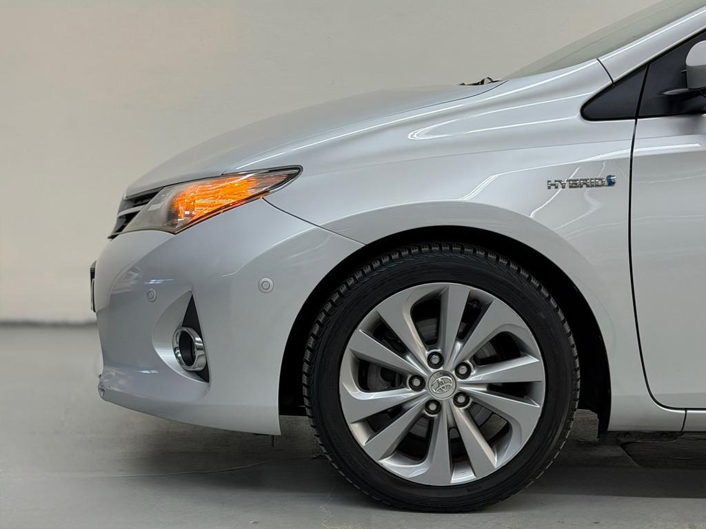 Toyota Auris Touring Sports 1.8 Hybrid Executive Stoelverwar, Auto's, Euro 5, Gebruikt, Leder en Stof, Origineel Nederlands