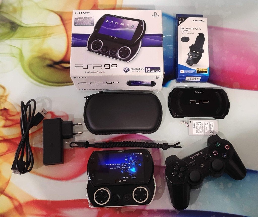 Sony Playstation PSP GO (Piano Black)– Exclusive Super Pack, Spelcomputers en Games, Spelcomputers | Sony PSP, Met games, Verzenden