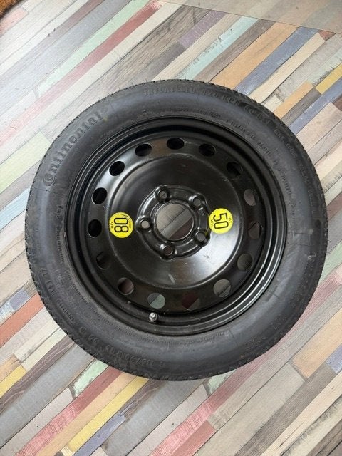 Thuiskomertje / reservewiel BMW e87, Ophalen