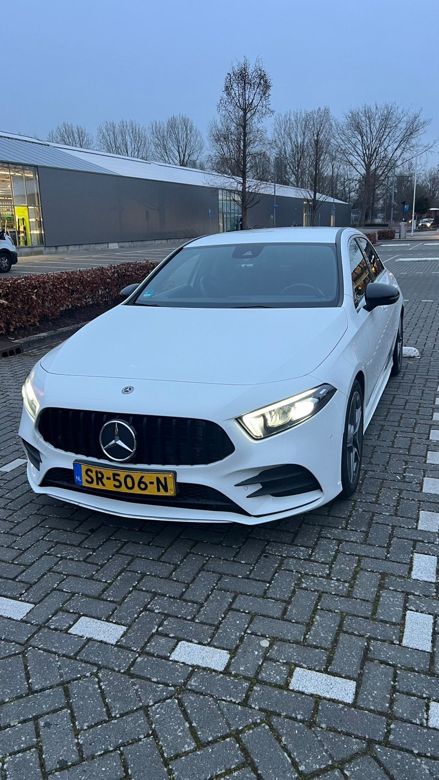 Mercedes-Benz A-Klasse A 200 163pk 7G-DCT 2018 Wit, Auto's, Zwart, 4 cilinders, Leder en Stof, Origineel Nederlands