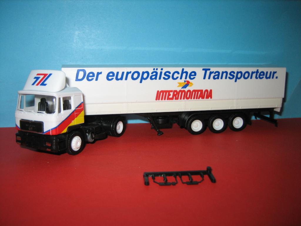 Intermontana  MAN  met oplegger  Herpa, Hobby en Vrije tijd, Modelauto's | 1:87, Ophalen of Verzenden, Zo goed als nieuw, Bus of Vrachtwagen