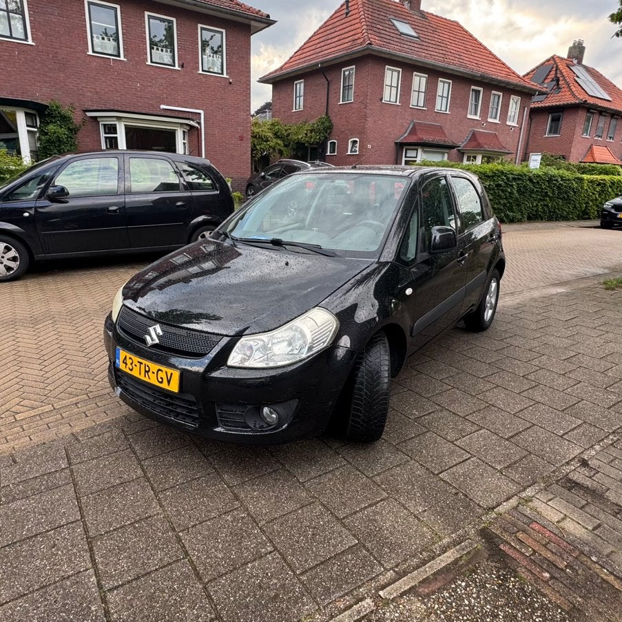 Suzuki SX4 1.6 Automaat 4x4 | Airco | Trekhaak, Stof, Zwart, 4 cilinders, SX4