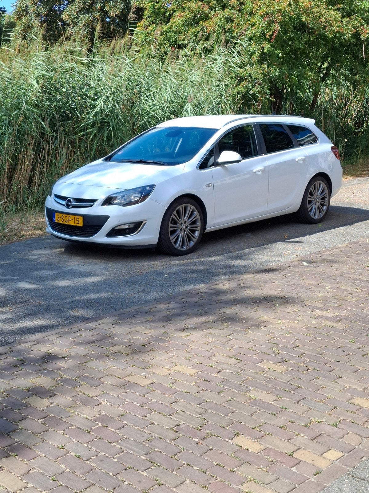 Opel Astra 1.4 Turbo 103KW Sports Tourer 2013 Wit, Auto's, Voorwielaandrijving, 4 cilinders, Wit, Origineel Nederlands