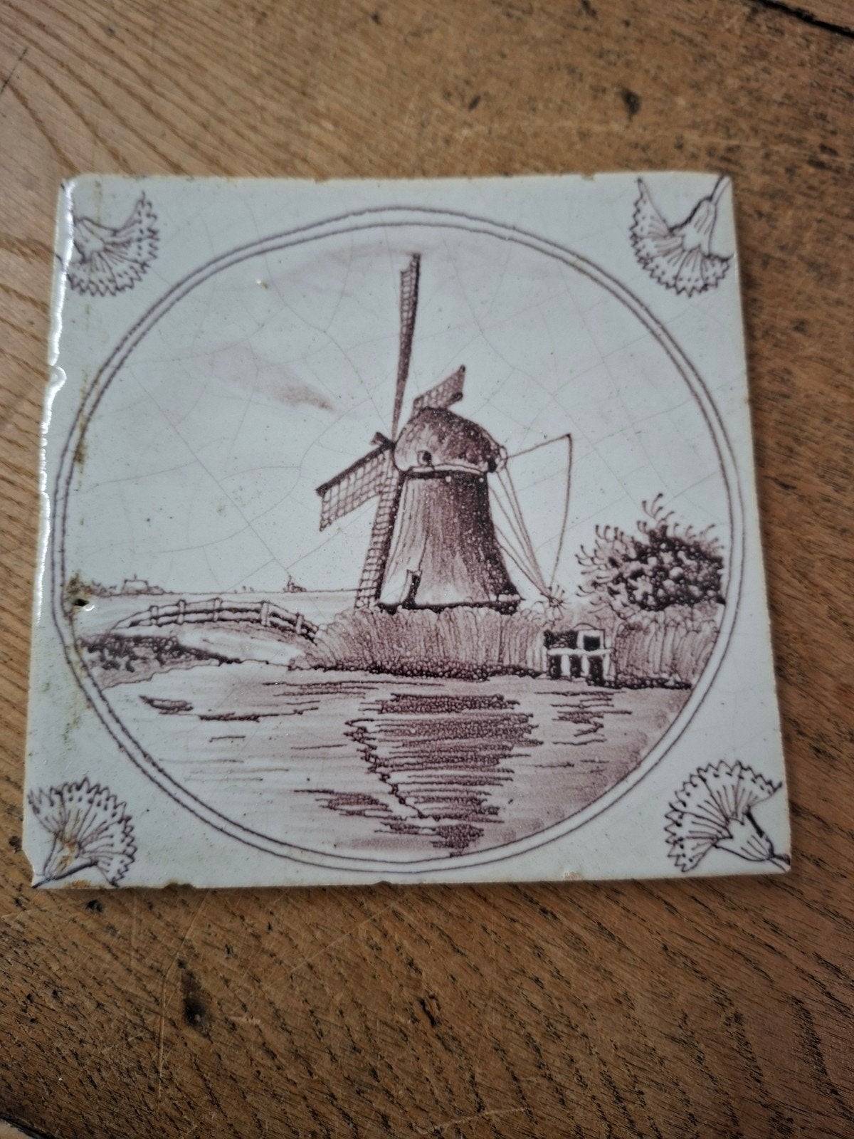 Antieke Nederlandse tegel met molenlandschap, Ophalen