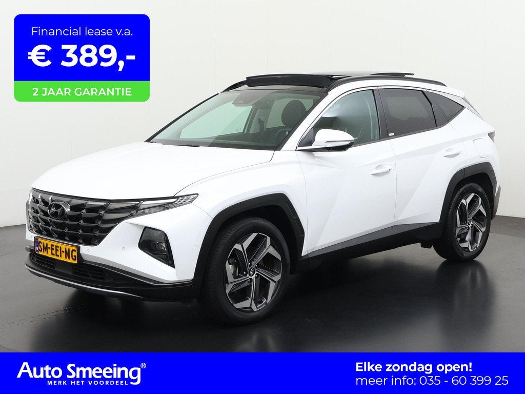 Hyundai Tucson 1.6 T-GDI PHEV Premium Sky 4WD | Panoramadak, Auto's, Hyundai, 14 kWh, Gebruikt, 4 cilinders, Wit