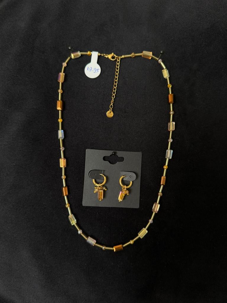 Exclusieve RVS set ketting en oorbellen naar luxe merk., Ophalen of Verzenden, Nieuw, Bruin, Overige materialen