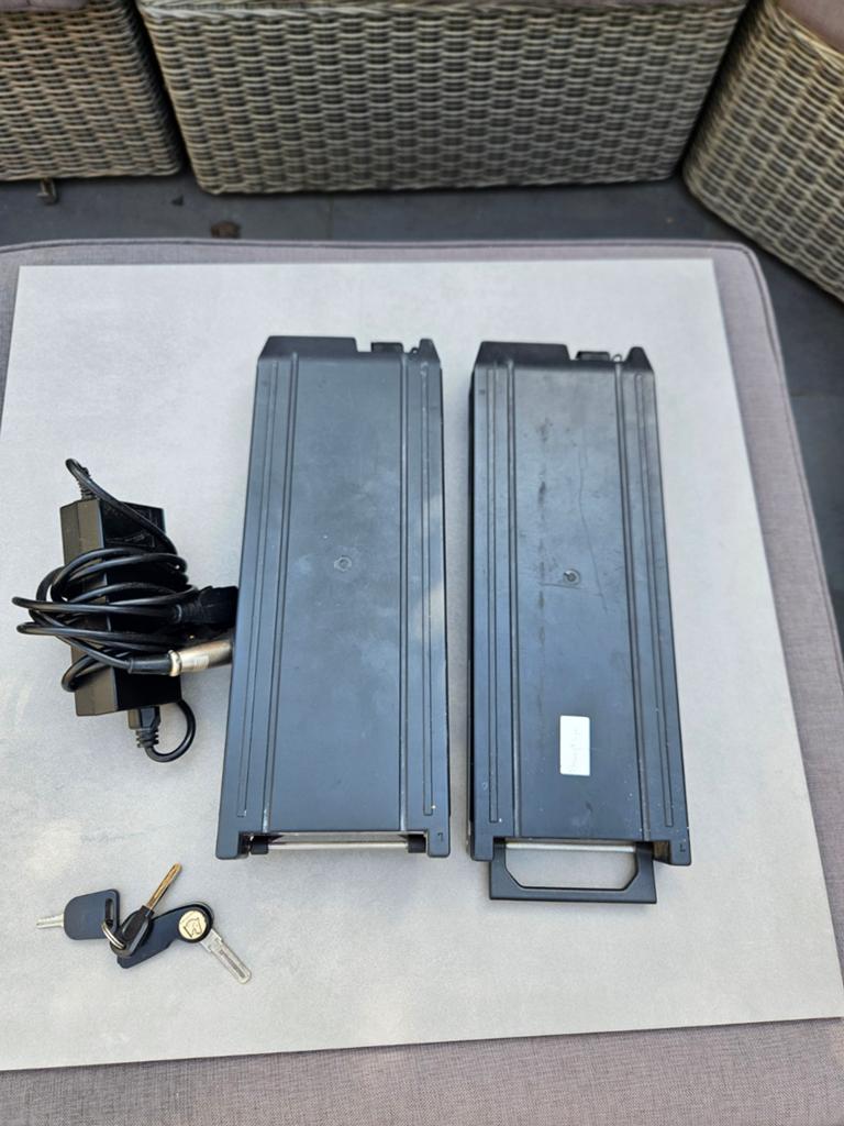 2 tranz x accu's met oplader., Ophalen of Verzenden, Gebruikt, Aanhangfiets, 80 kg of meer