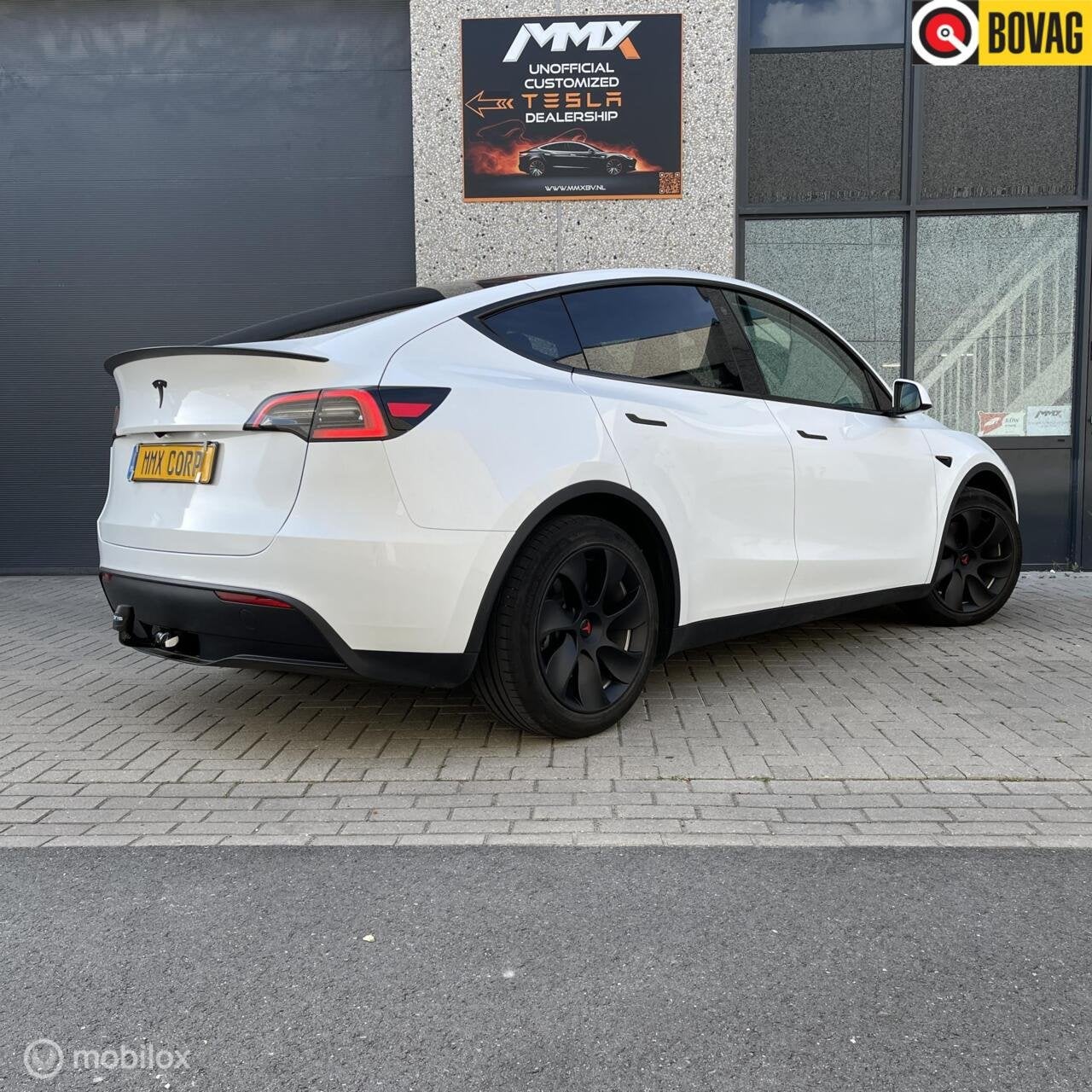Tesla Model Y PREMIUM LFP +MMX PACK+ IAP + TREKHAAK+SOH94.6%, Automaat, Achterwielaandrijving, Gebruikt, Zwart