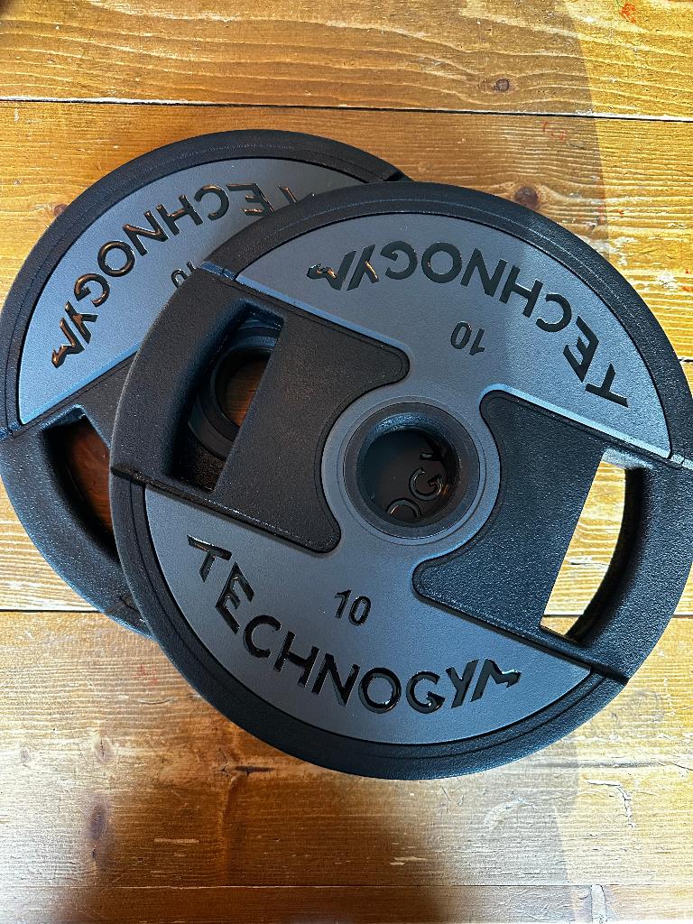 Technogym Urethane Schijven - NIEUW - 10 KG (Nieuw in Doos!), Ophalen of Verzenden, Nieuw, Benen, Halterschijven