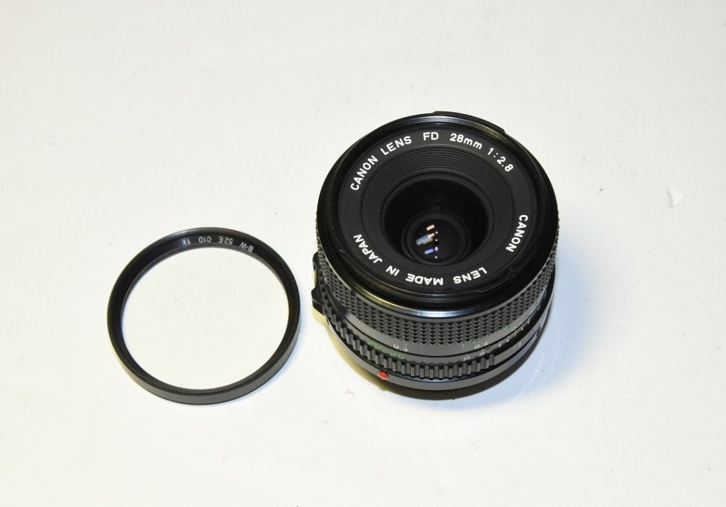 Canon FD 28mm 2.8 Nieuwstaat., Canon, Canon FD, Zo goed als nieuw, Lensdoppen