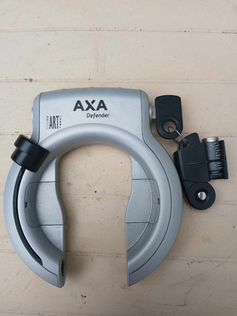 Nieuw AXA ringslot Defender zilver + extra cilinder, Fietsen en Brommers, Fietsaccessoires | Fietssloten, Ophalen of Verzenden