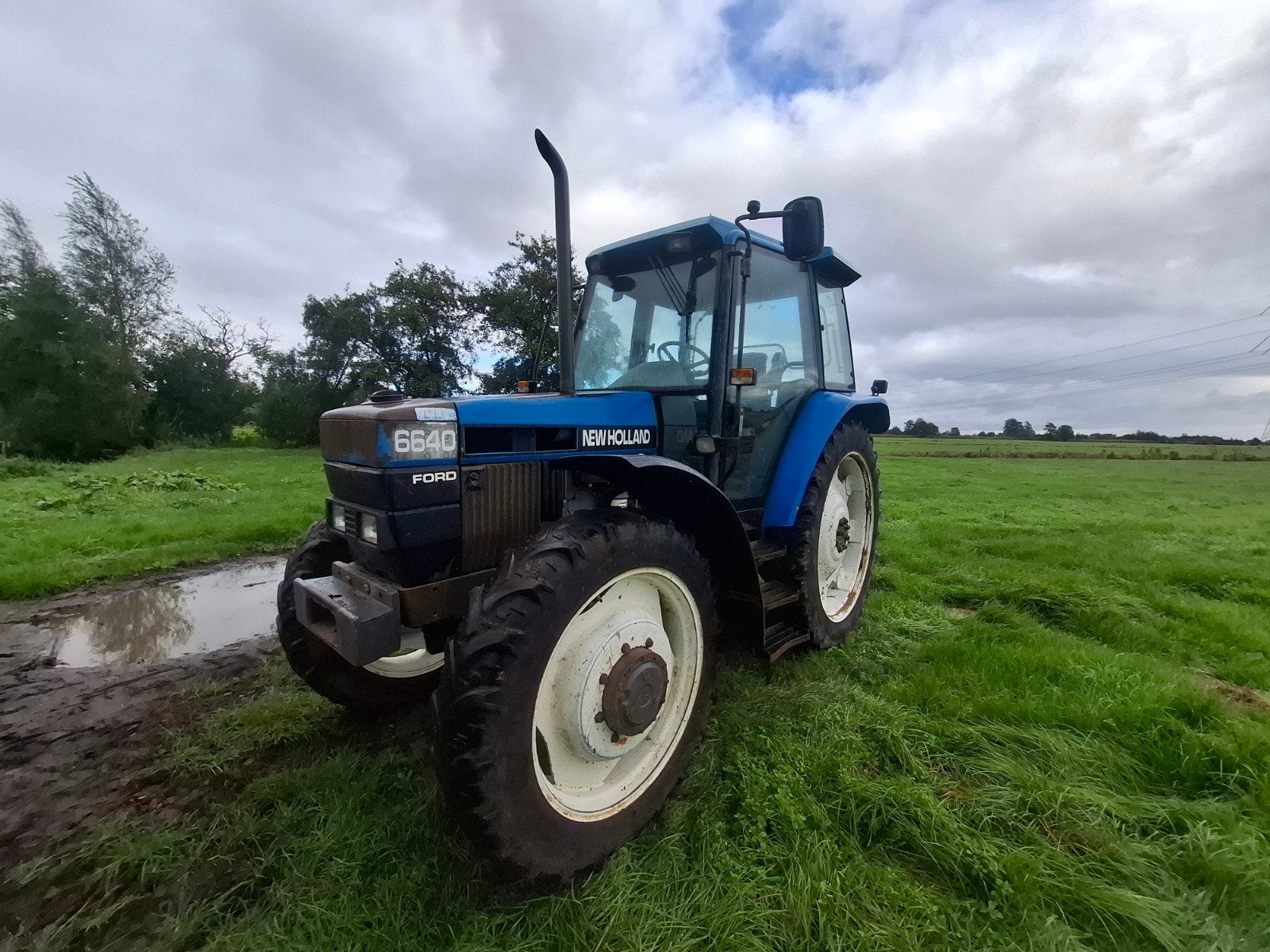 New holland 6640, Ophalen, 80 tot 120 Pk, Gebruikt, Meer dan 10000