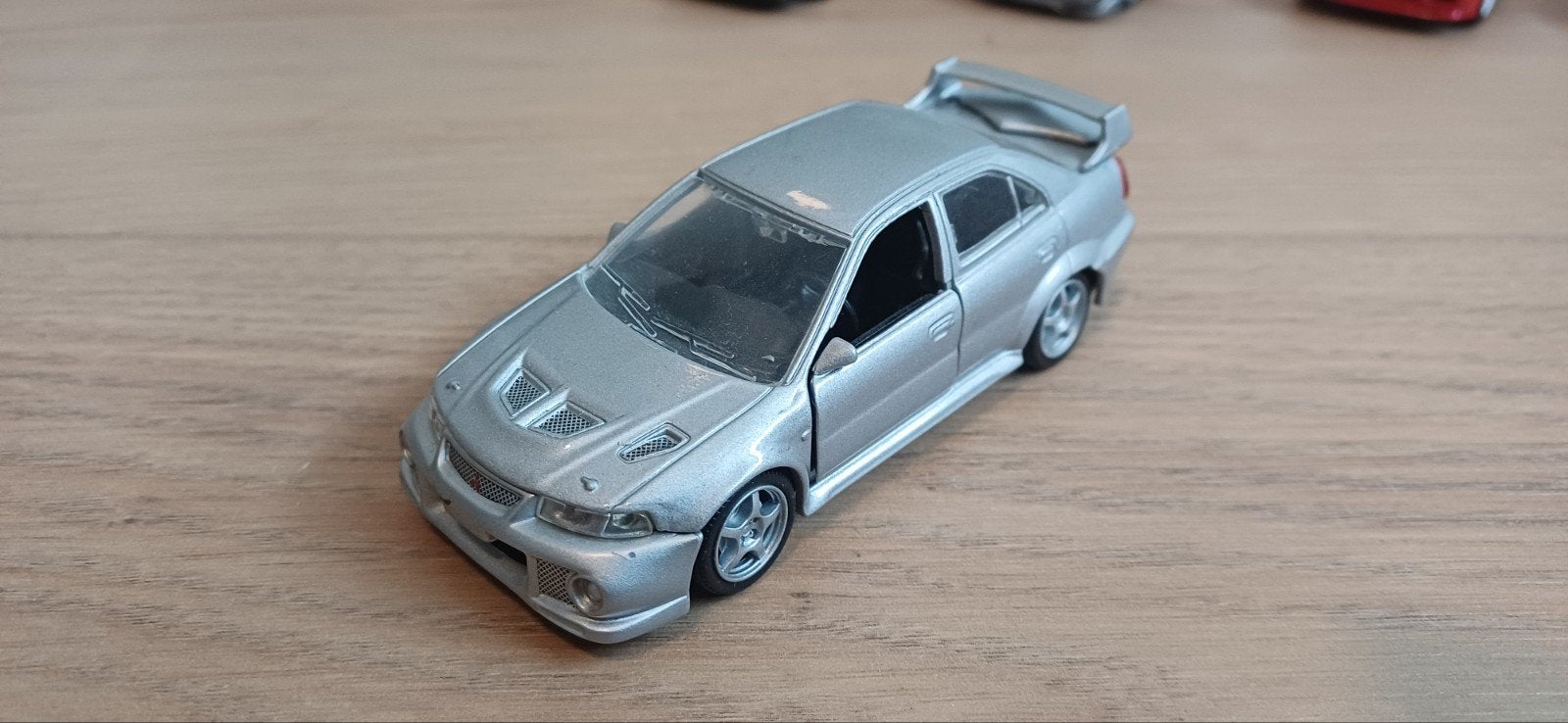 Zilveren Mitsubishi Lancer Evolution 5 (Rs) modelauto 1/43, Ophalen of Verzenden, Zo goed als nieuw, Auto