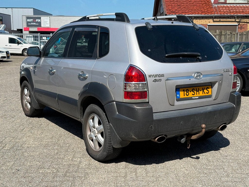 Hyundai Tucson 2.7i V6 4WD Style LEER/CLIMA/TREKHAAK, Auto's, Hyundai, Automaat, Gebruikt, 2656 cc, Bedrijf