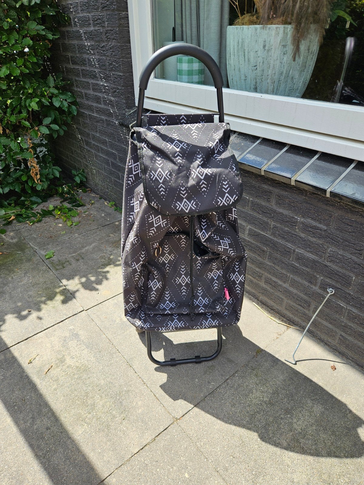 Handig boodschappen karretje, Ophalen