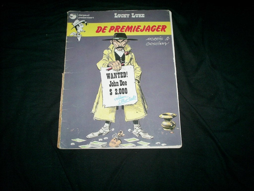Lucky Luke - De Premiejager (1972) - Beschadigd exemplaar, Gelezen, Eén stripboek, Ophalen of Verzenden, Morris & Goscinny