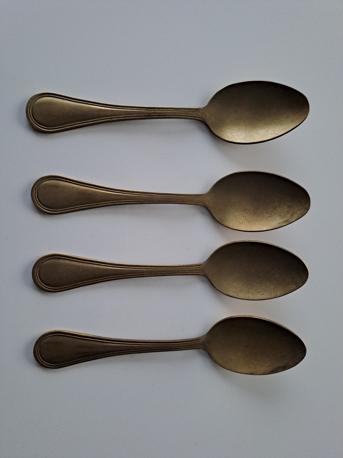 4 brons/ goudkleurige koffielepels Xenos nieuwstaat, Ophalen of Verzenden, Zo goed als nieuw, Overige stijlen, Overige typen