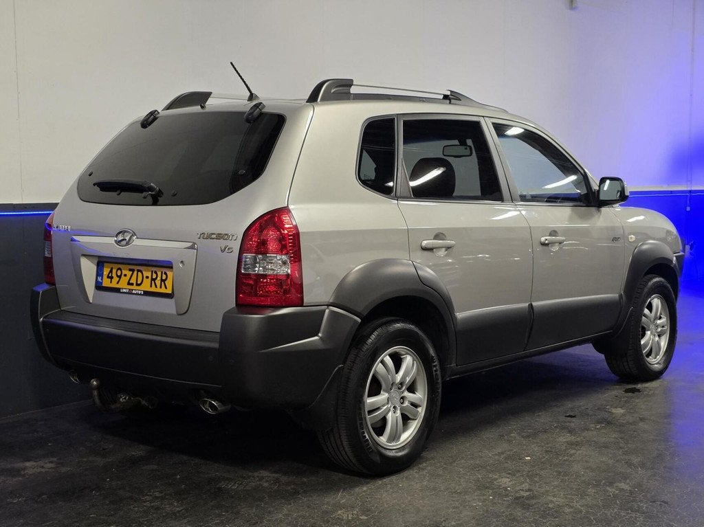 Hyundai Tucson 2.7i V6 4WD Style | Automaat | Leder | Trekha, Auto's, Automaat, Gebruikt, 2656 cc, Bedrijf