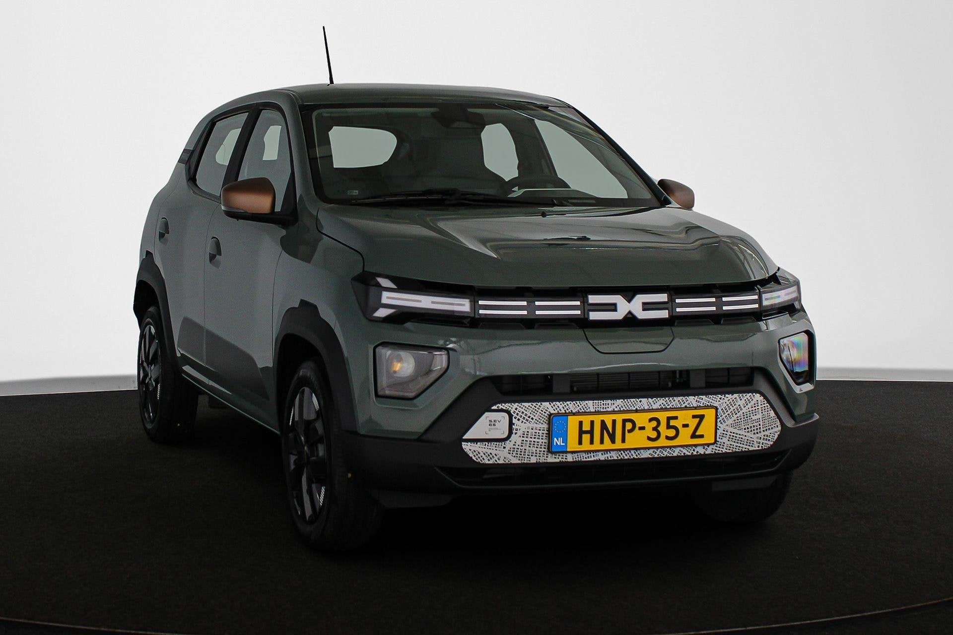 Dacia Spring Extreme 65 26.8 kWh Camera Apple CarPlay Airco, Auto's, Gebruikt, 4 stoelen, Leder en Stof, Origineel Nederlands