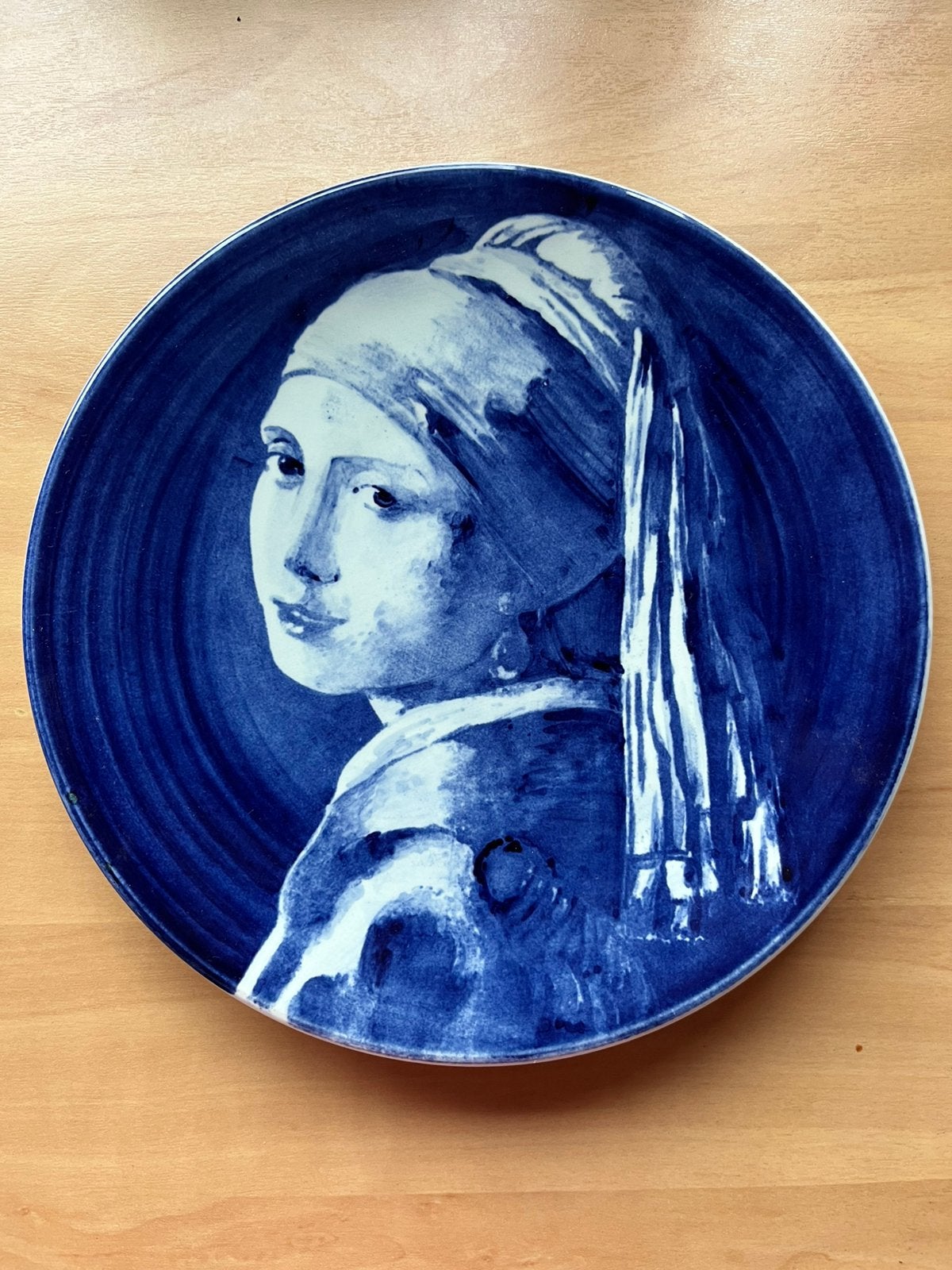 Bord meisje met de parel, Ophalen