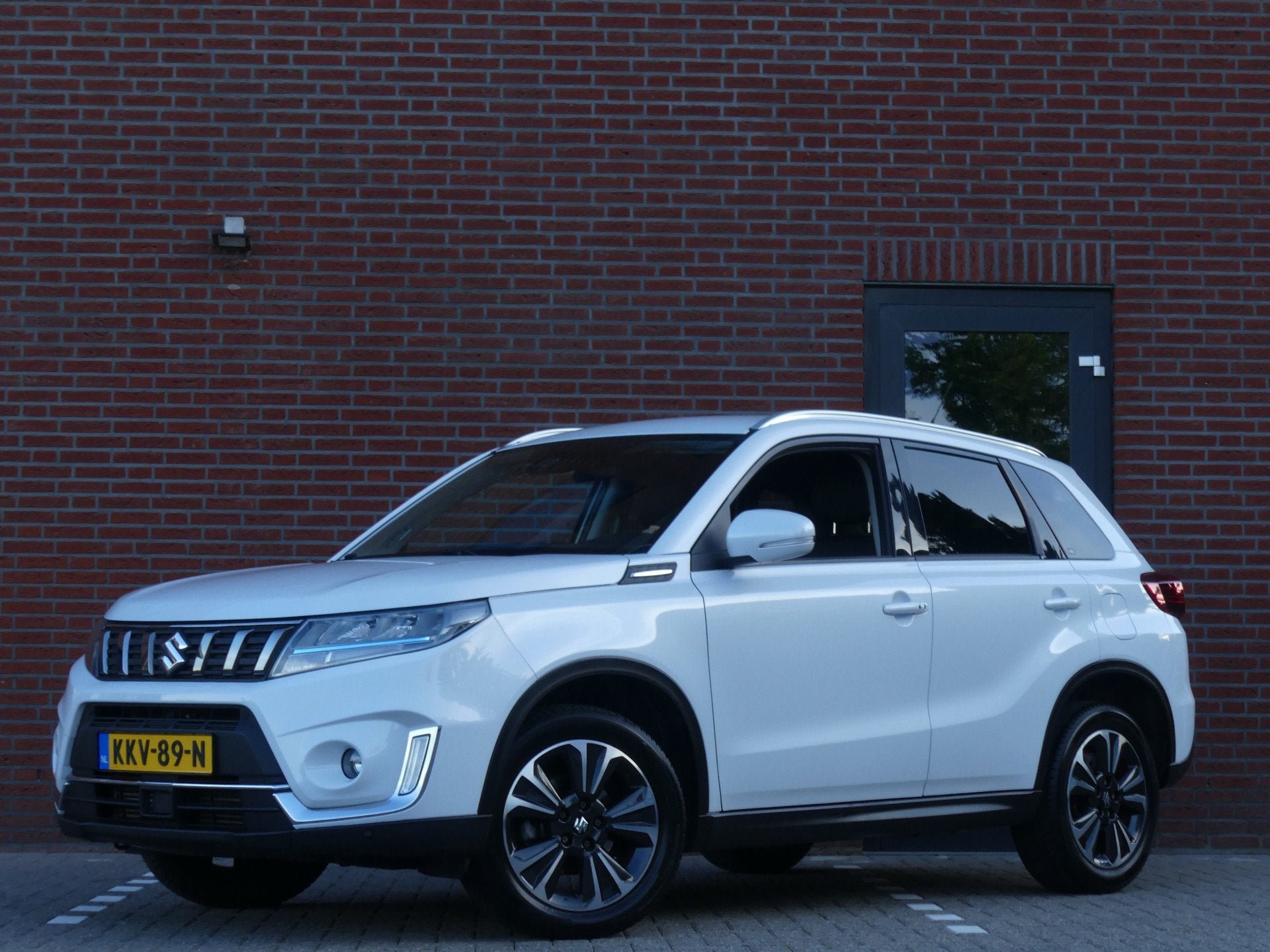 Suzuki Vitara 1.4 Boosterjet Style Smart Hybrid (bj 2021), Auto's, Dealer onderhouden, Gebruikt, 4 cilinders, 129 pk