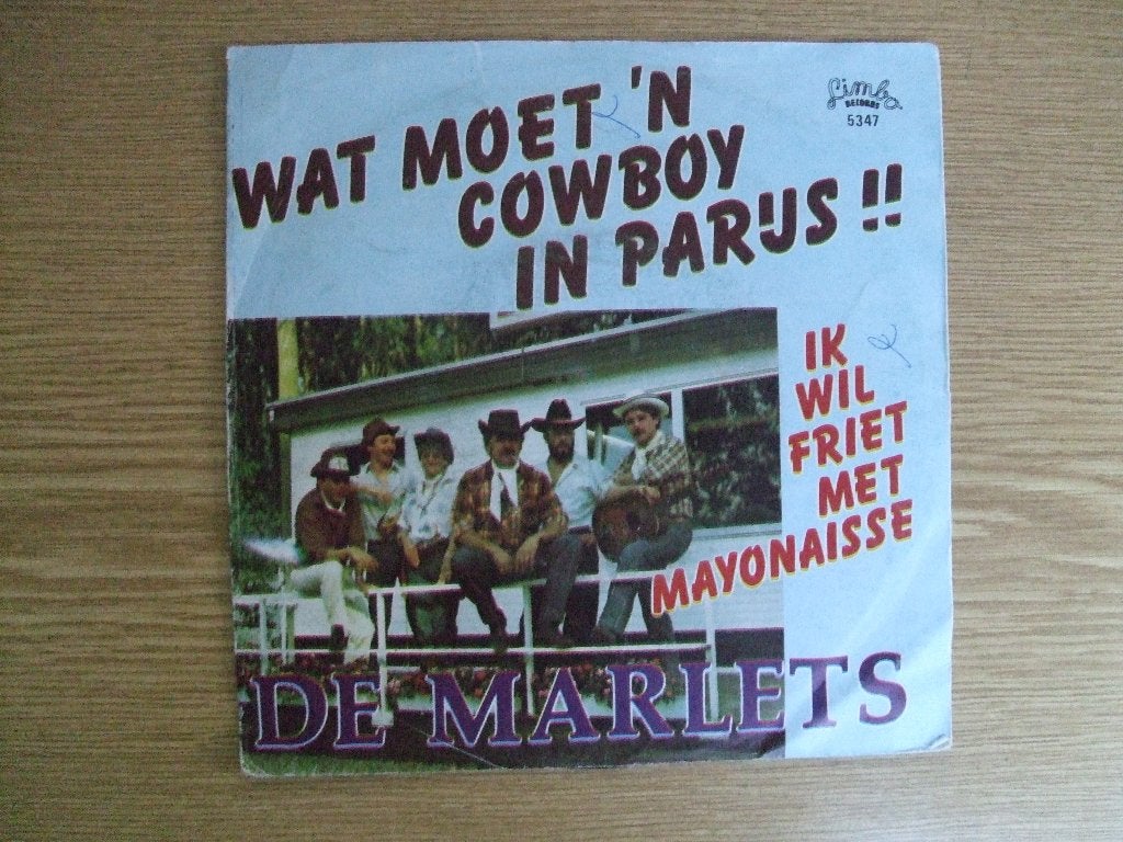 DE MARLETS   WAT MOET 'N COWBOY IN PARIJS / IK WIL FRIET MET, 7 inch, Ophalen of Verzenden, Zo goed als nieuw, Nederlandstalig