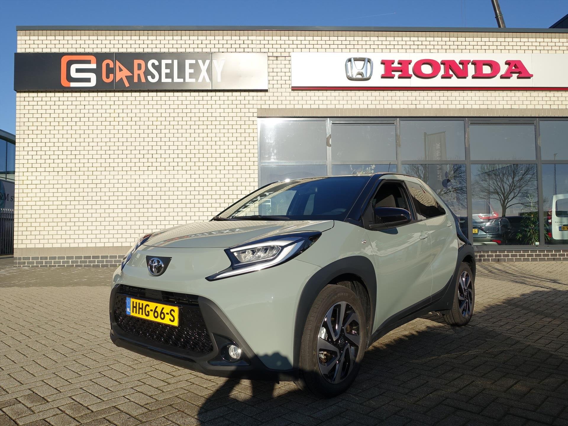 TOYOTA Aygo X 1.0 VVT-i MT 72pk Pulse Bi-Tone, Auto's, 21 km/l, Stof, Gebruikt, 4 stoelen