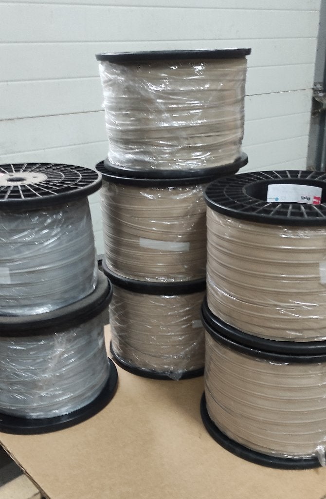 1750 mtr optilon S80 spiraalrits op rol beige en grijs, Ophalen, Nieuw, Rits of Sluiting