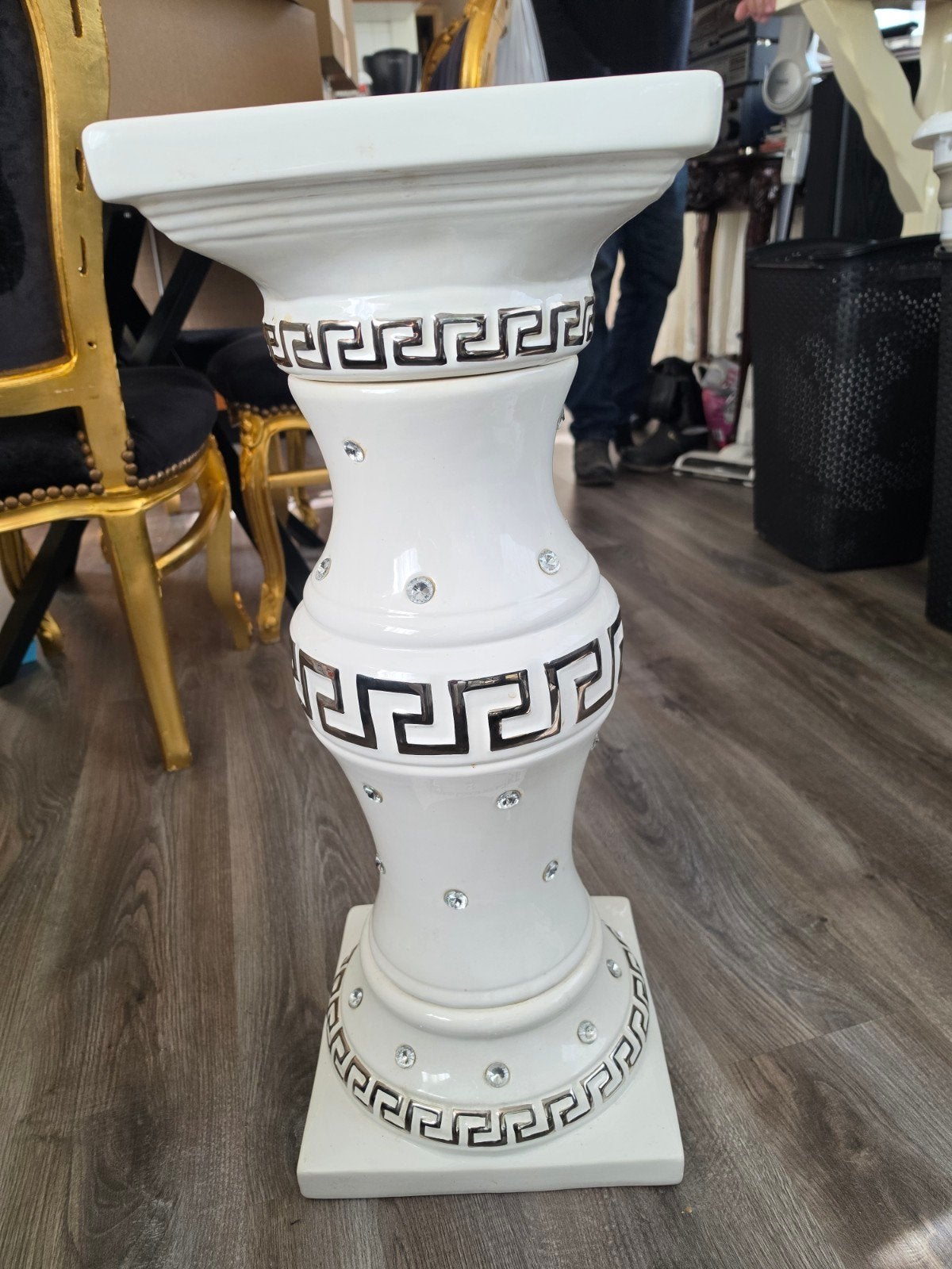 versace pilaar, Ophalen