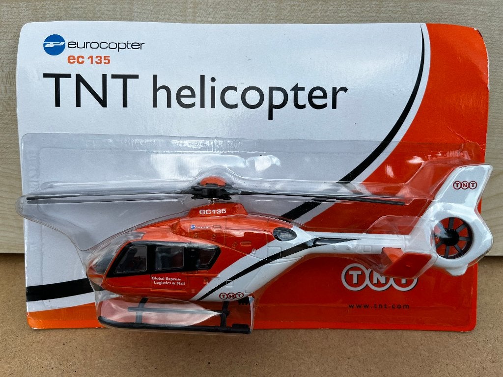 Display model TNT helicopter EC135 / verzamel - nostalgie, Overige merken, 1:144 tot 1:200, Helikopter, Nieuw