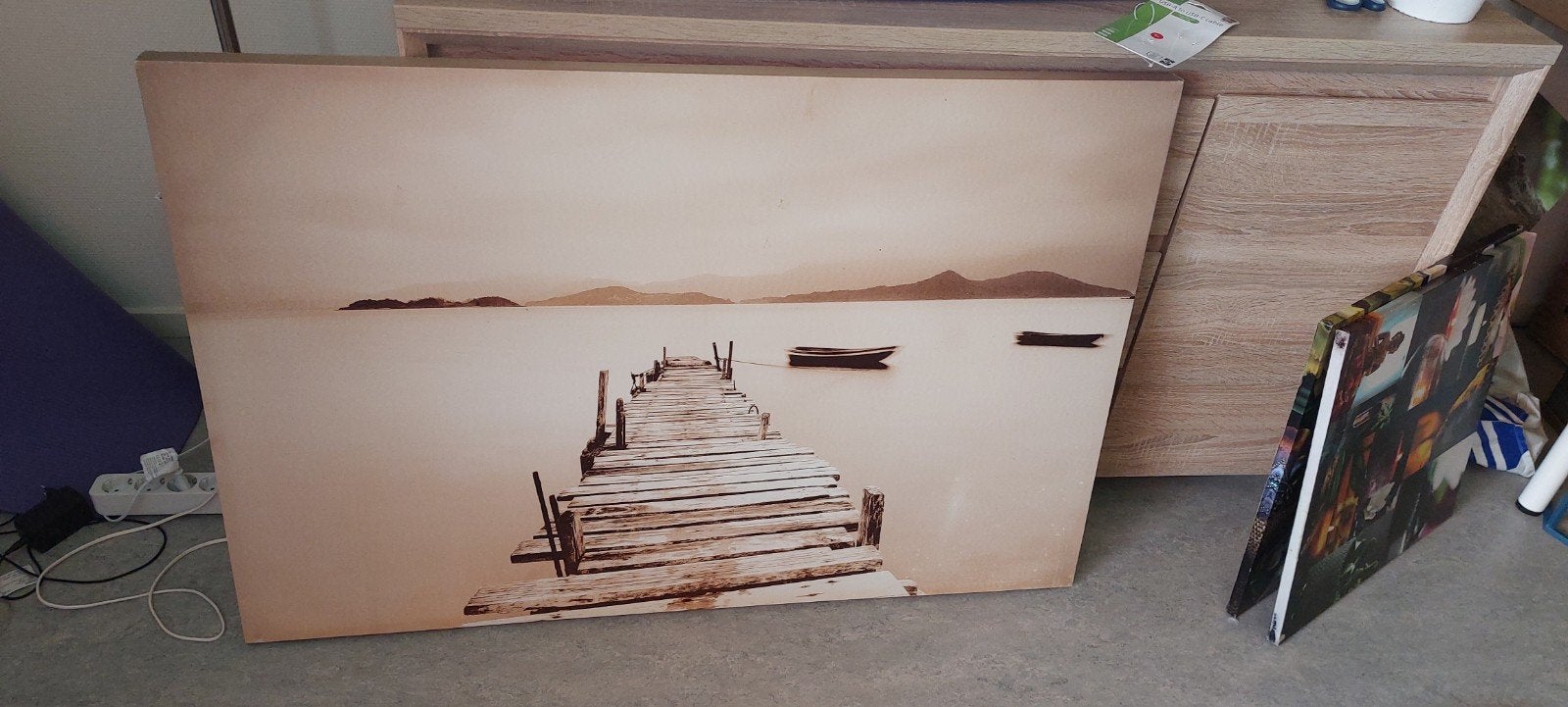 Schilderij steiger aan het water, Ophalen