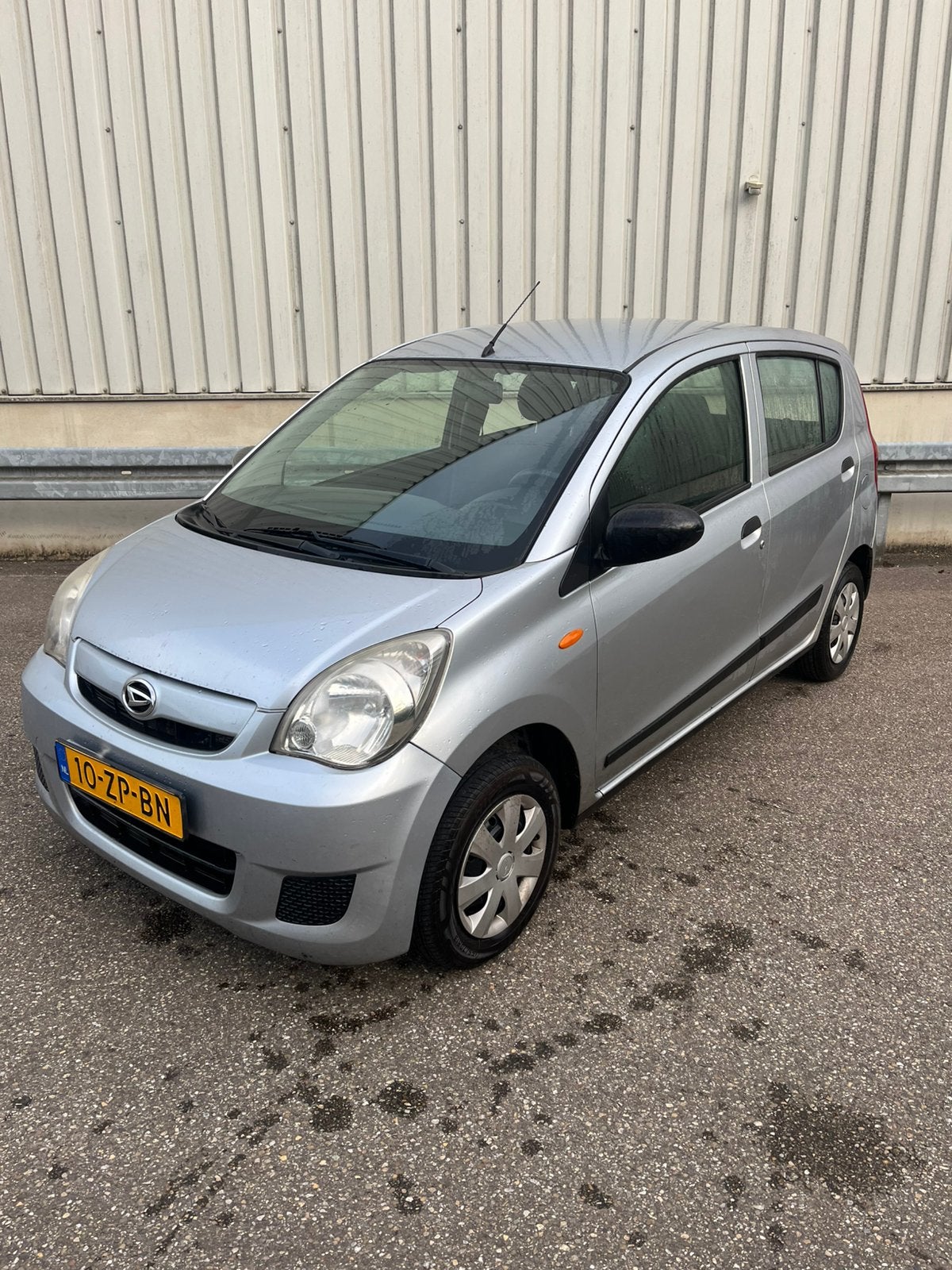 Daihatsu Cuore 1.0 5D 2009 Grijs, Auto's, Voorwielaandrijving, Stof, 18 €/maand, 700 kg