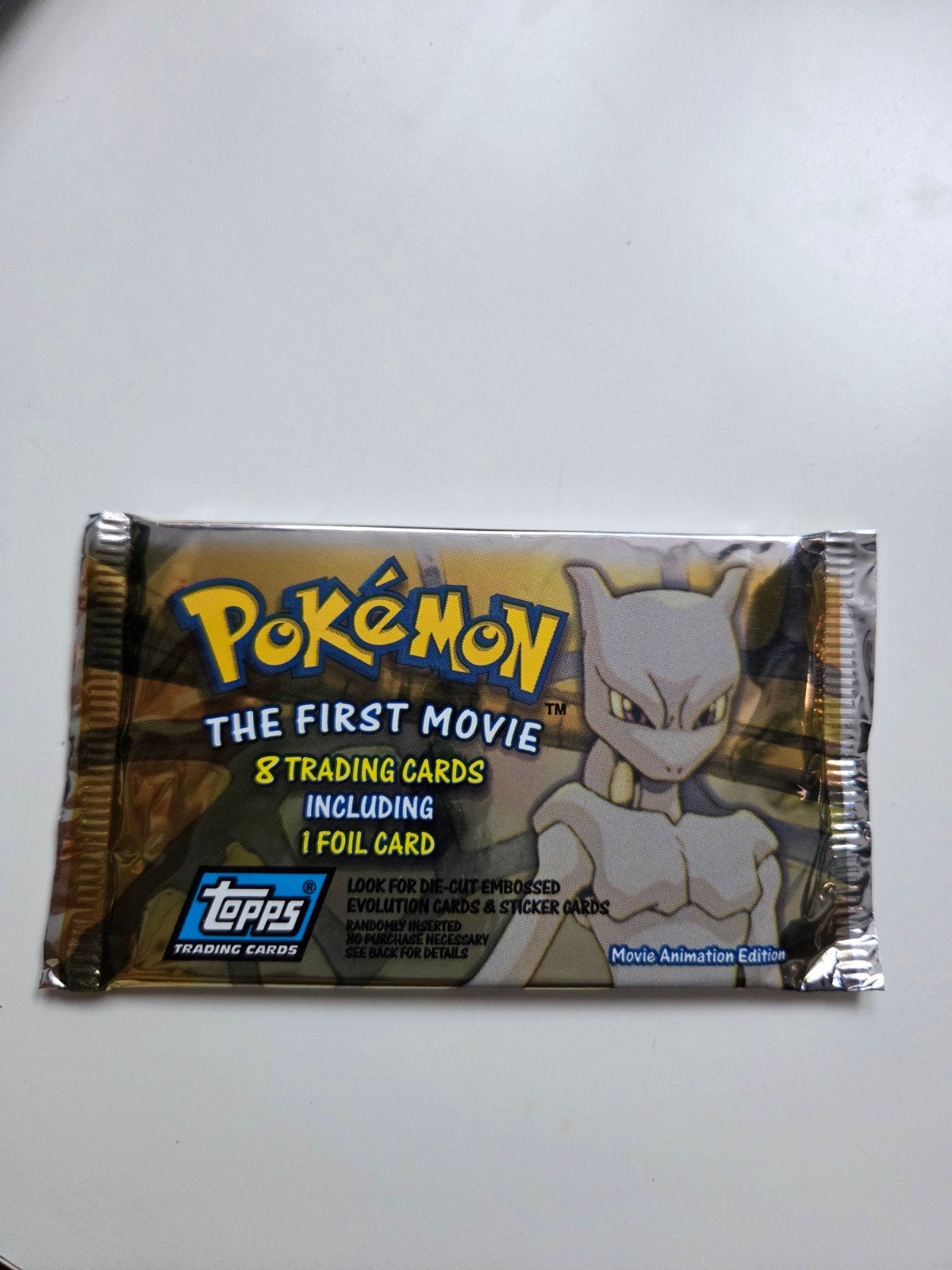 Pokemon Topps First Movie FACTORY SEALED Booster pack, Ophalen of Verzenden, Nieuw, Booster, Foil