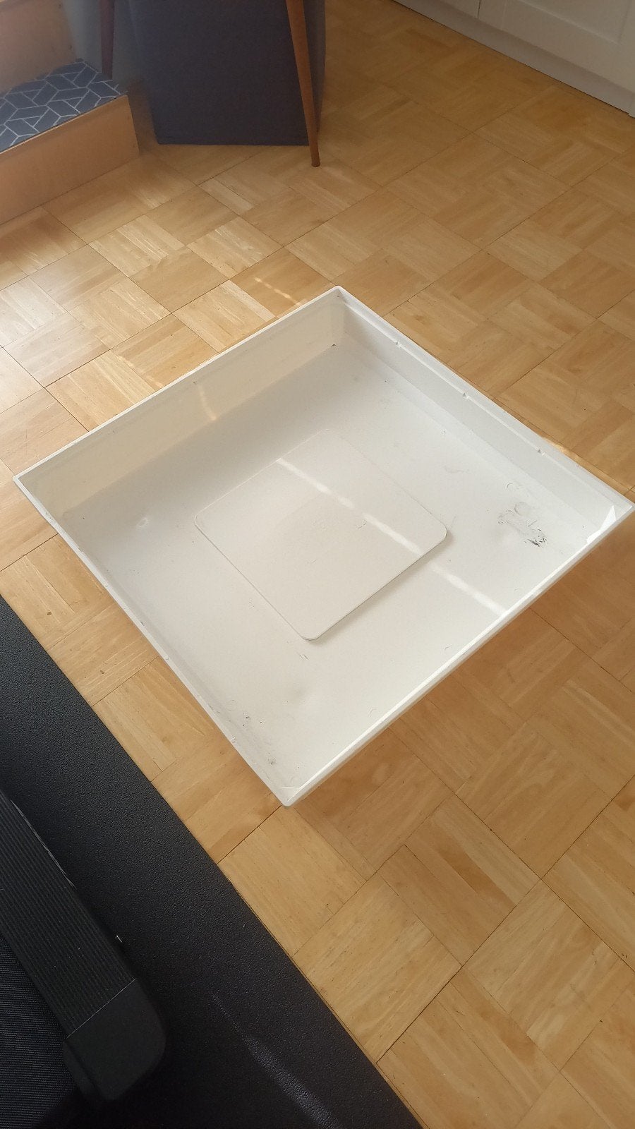 wasmachine opvangbak, Ophalen