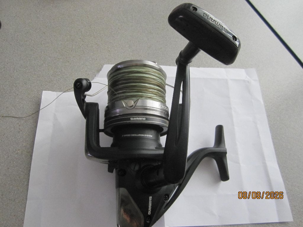 vis molen merk shimano 10000 2 speed oscillation system+lijn, Ophalen, Zo goed als nieuw, Molen
