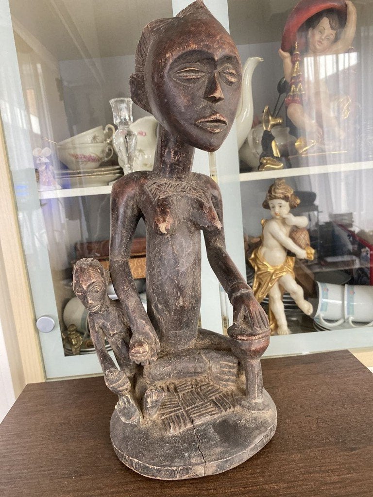 Een Agni-moederschap, regio Malaba, Ivoorkust., Ophalen