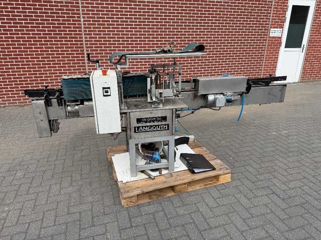 Etiketteermachine de Groot, Ophalen