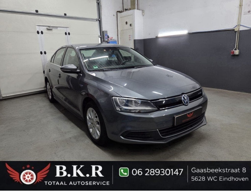 Volkswagen Jetta 1.4 Hybrid 170PK  Grijs | PDC | Clima, Auto's, Stof, Origineel Nederlands, Grijs, Hybride Elektrisch/Benzine