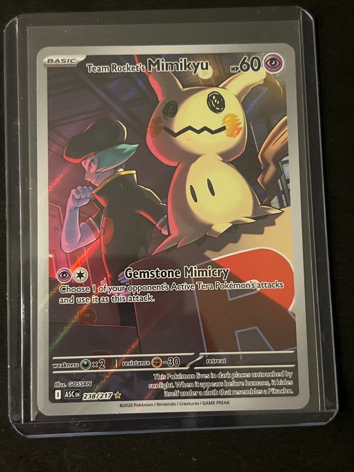 Pokémon Kaart: Team Rocket's Mimikyu (Foil) 238/217, Ophalen, Zo goed als nieuw, Losse kaart, Foil