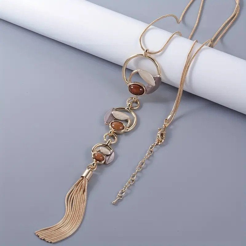 Lange ketting in goudbruin, Sieraden, Tassen en Uiterlijk, Kettingen, Nieuw, Overige materialen, Bruin, Met hanger, Verstelbaar