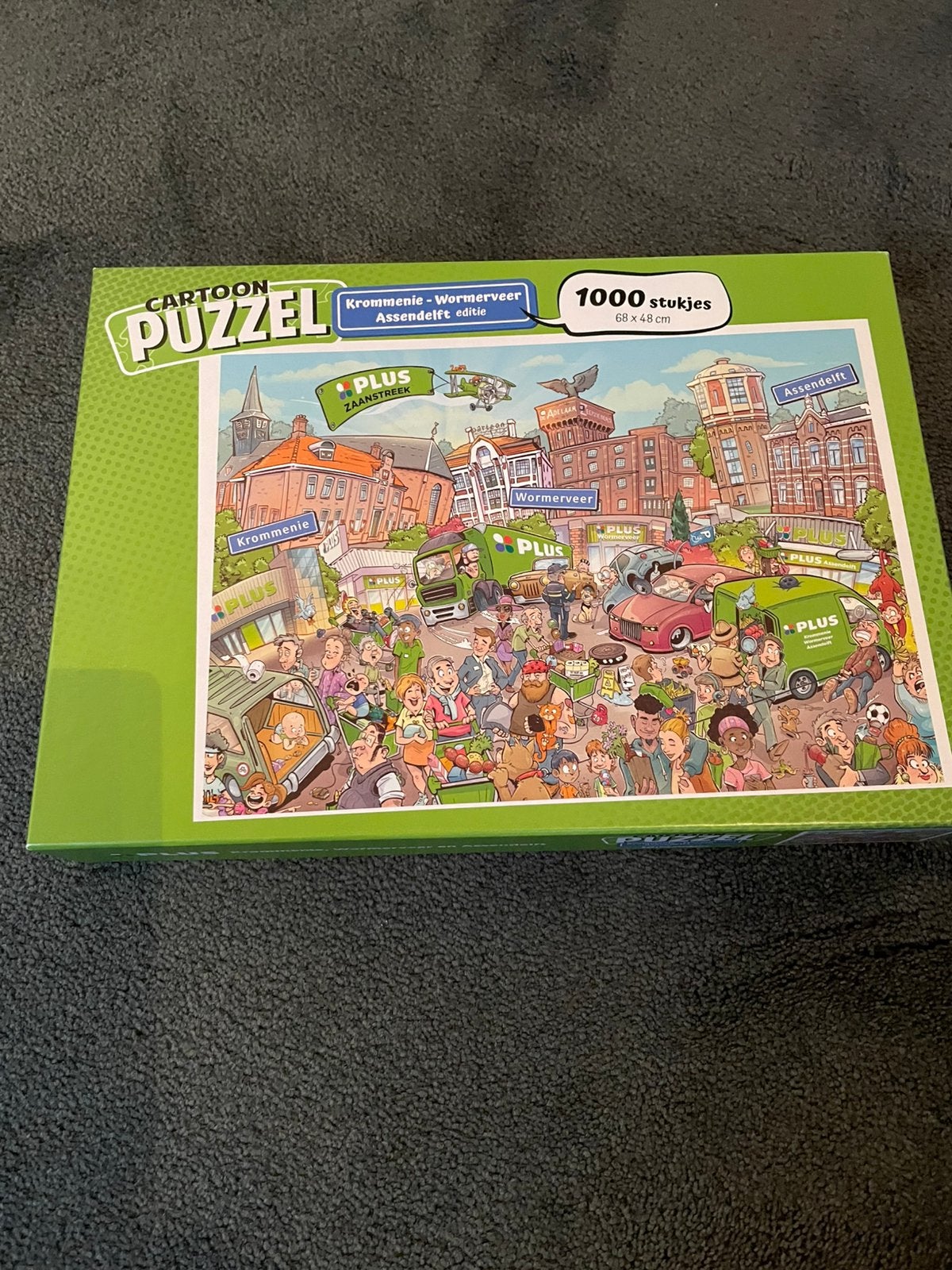 Puzzel; cartoonpuzzel van Plus Zaanstreek, Ophalen, 500 t/m 1500 stukjes, Zo goed als nieuw